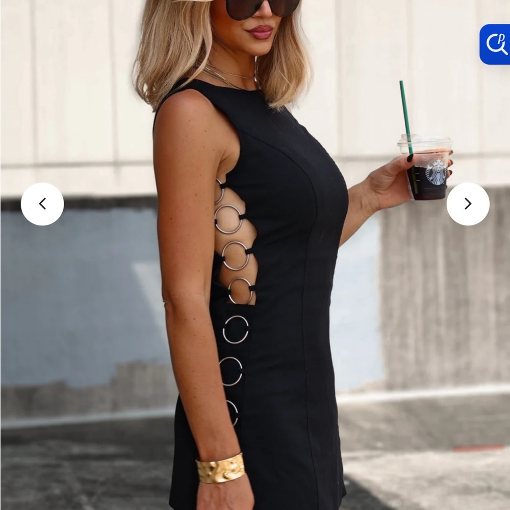 Vestique Elegant Black Mini Dress with Side Rings